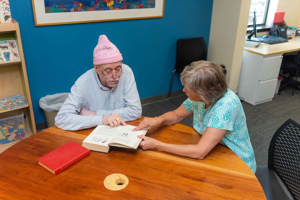 Two people working at a table