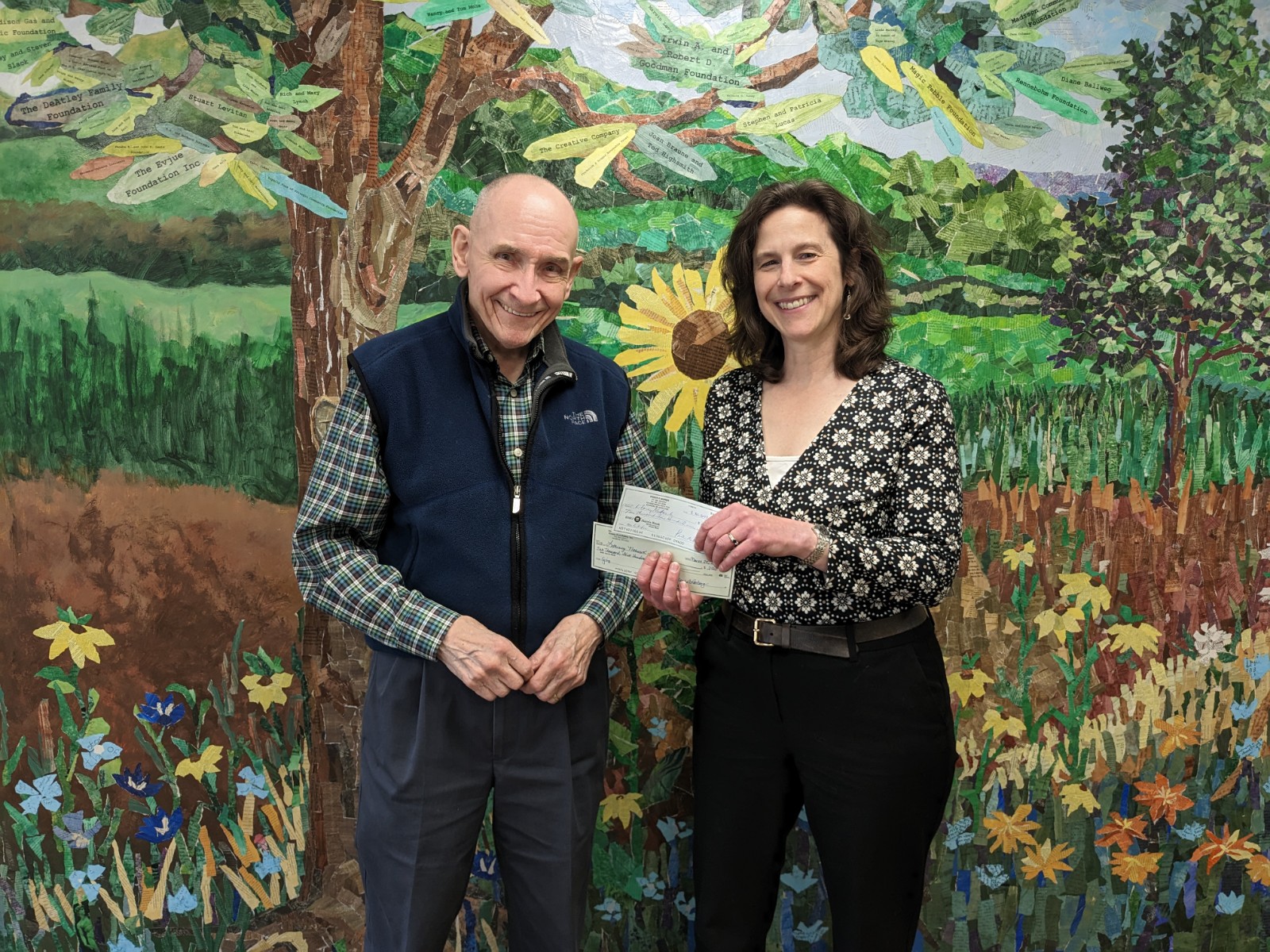 Robin Ryan receives check from Rotary Club